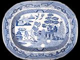a blue and white platter with a picture of a pagoda