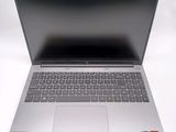 an open laptop computer sitting on top of a white table