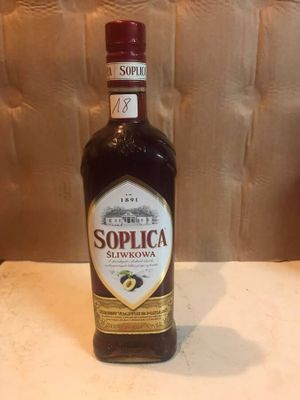 a bottle of liquor sitting on a counter top