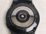 a close up of a watch with a camera attached to it