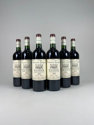 six bottles of wine are lined up in a row