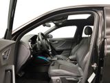 the interior of a car with the door open and the driver ' s seat down