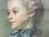 portrait of a young woman in a blue dress with a blue bow tie