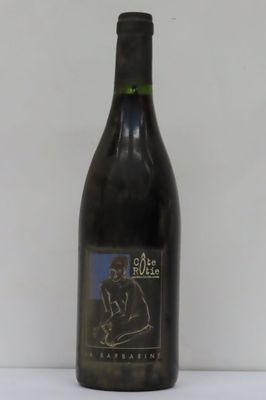 a bottle of wine that is sitting on a table