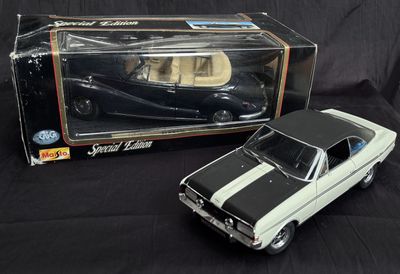 a black and white model of a car and a black and white box