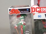 two boxes of action figures are shown on a white surface