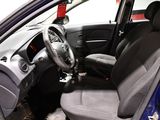 the interior of a small car with a steering wheel and a dashboard