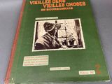an old book with a picture of a man in a gas mask on it