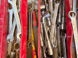 a box full of tools that are sitting on the floor