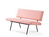 pink upholstered bench with black legs on a white background