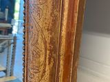 an image of a mirror with a wooden frame