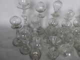 a lot of glass vases that are sitting on a table