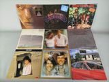 a lot of cds on the table with pictures on them