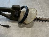 an image of a corded hedger on the floor