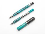 three different types of fountain pens on a white surface