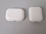 two white apple airpods sitting next to each other on top of a table