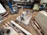 a lot of junk on the ground in a garage