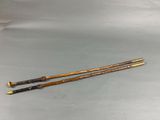 two old canes are sitting next to each other on a table