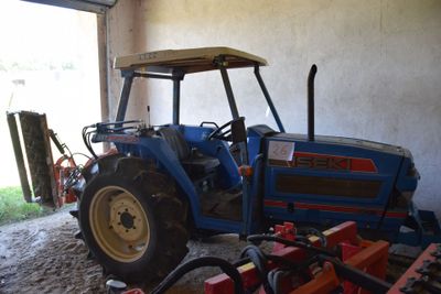 a tractor that is parked in a garage