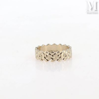 a gold ring with a heart design on it