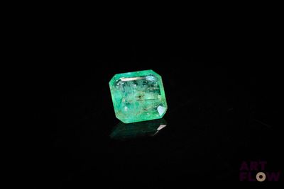 a green emerald in the dark