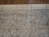 an old map of the area of a city on a wooden floor