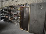 a refrigerator in a room with a lot of items on the shelves