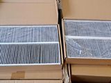 two boxes of air filters are stacked on top of each other
