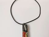 a necklace that has a picture of a person on it