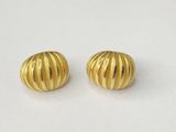 a pair of gold toned earrings