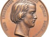 une image représentant une médaille de bronze avec le profil d'une femme