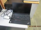 a laptop computer sitting on top of a white table