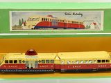 a toy train that is in a box on the table