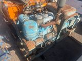 an old engine that is sitting on the ground