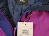 a purple backpack with a price tag on it