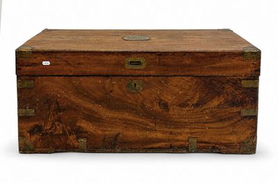a small wooden box with a metal latch on it