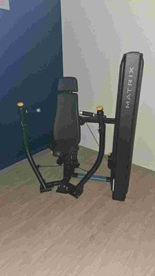 an image of a home gym equipment in the corner of a room