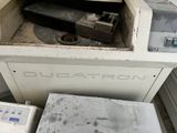 a machine that is sitting in a room with a lot of stuff