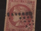 un vieux timbre sur lequel figure l'image d'une femme