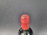 a bottle of wine that is sitting on a table