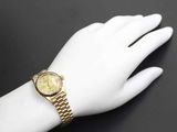 a close up of a person ' s hand with a watch on it