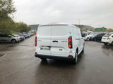 a white van that is parked in a parking lot