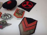 many different types of badges on a table