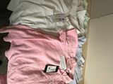 a pile of clothes on the floor next to a dresser