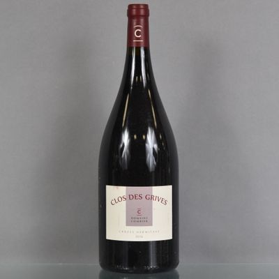 a bottle of wine that is sitting on a table