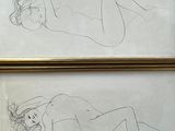 two drawings of a woman laying down on a bed