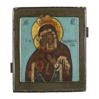 une icône représentant la Vierge et l'Enfant Jésus sur fond bleu