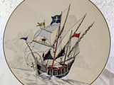 a plate with a picture of a ship on it