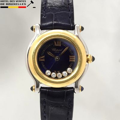 a close up of a watch with diamonds on the face