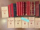 several books on a table with a blue tag on them